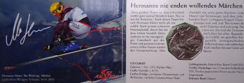 5-Euro-Silbermünze Österreich 2005 „100 Jahre Skisport – Hermann Maier“ in originalem Miniblister, Prägequalität Handgehoben (HGH), Motiv mit Skifahrer und stilisiertem Schneekristall
